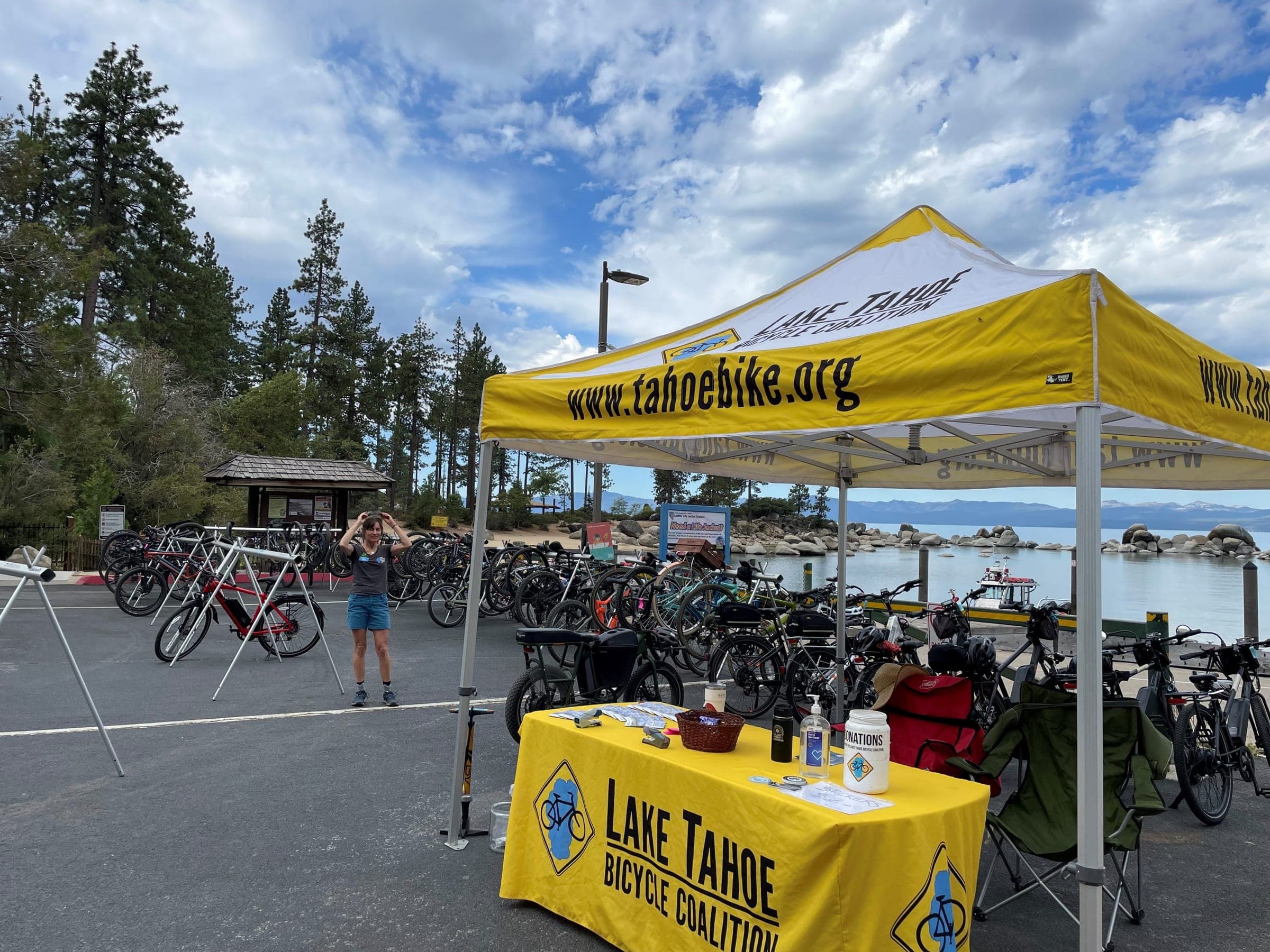 Rows of bicycles parked inside the fenced bike valet at an event